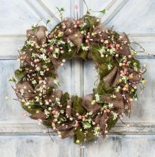 BURLAP WREATH WITH MIXED BERRIES AND PARCHMENT FLOWERS  ON A